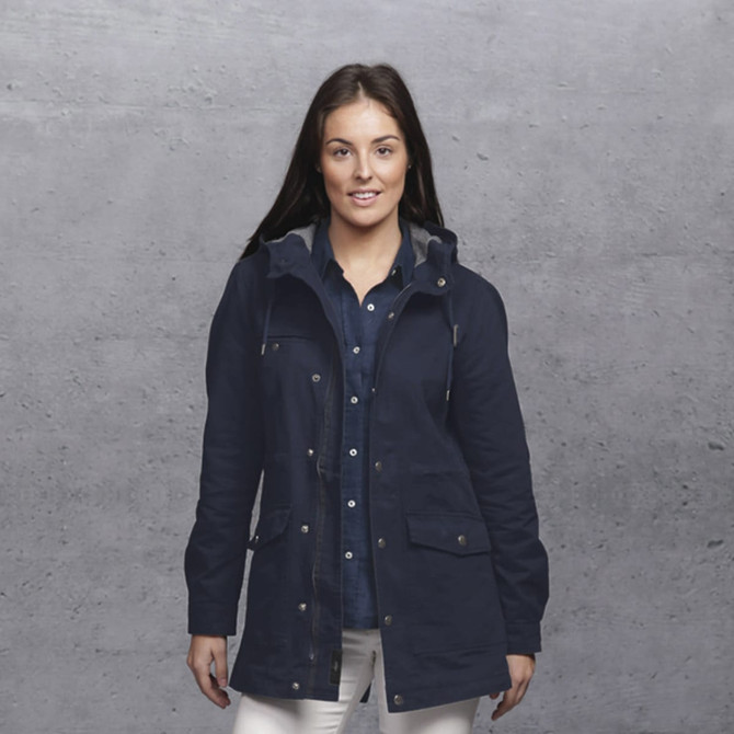 A navy jacket with a hood, featuring multiple pockets and a model posing in front of a grey background. A navy jacket with a hood, featuring multiple pockets and a model posing in front of a grey background.