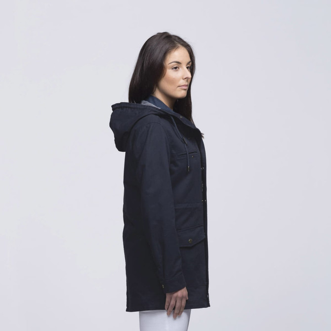 A navy twill jacket with a hood, featuring pockets and a simple design, shown on a model from the side. A navy twill jacket with a hood, featuring pockets and a simple design, shown on a model from the side.