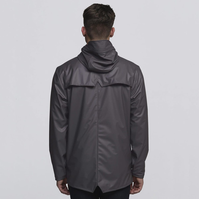 A grey rain jacket with a hood, featuring a back vent and a logo.
