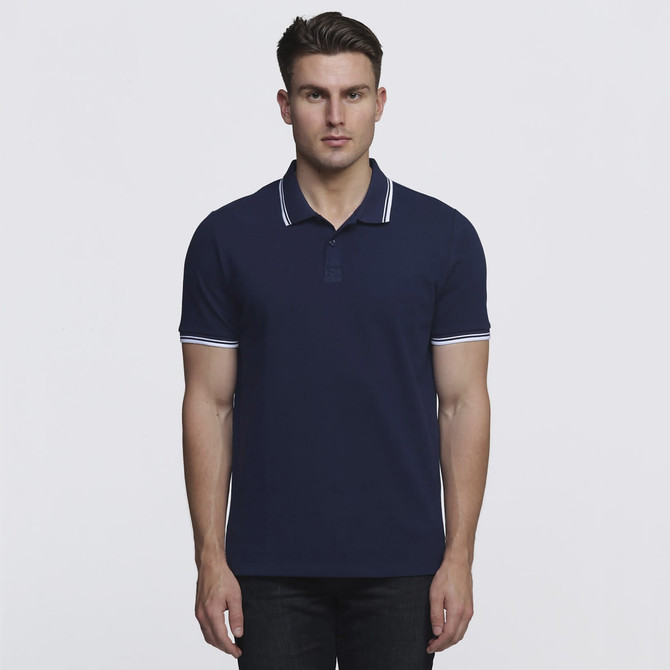 A navy polo shirt with contrasting white trim and a logo, featured in a front view on a model.
