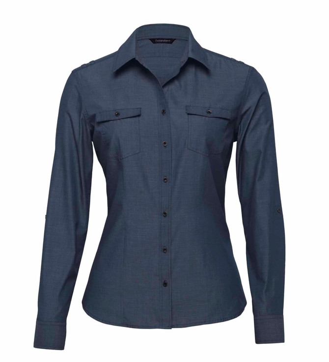 A women's button-up shirt in a dark blue colour with long sleeves and two chest pockets. It features a logo. A women's button-up shirt in a dark blue colour with long sleeves and two chest pockets. It features a logo.