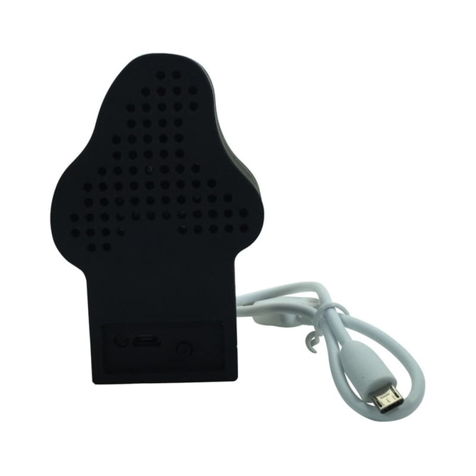 A black custom moulded Bluetooth speaker with a white charging cable. The speaker features multiple small holes for sound output. A black custom moulded Bluetooth speaker with a white charging cable. The speaker features multiple small holes for sound output.