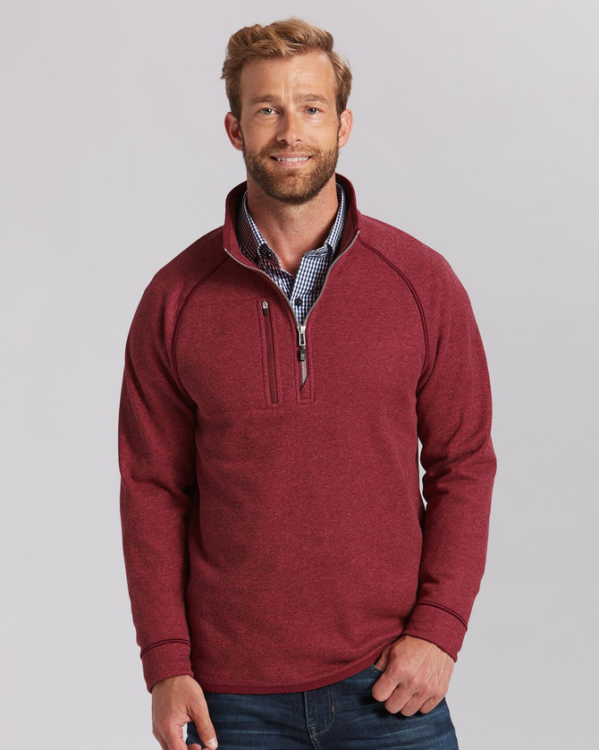 A men's half zip jacket in a rich burgundy colour, featuring a logo and a relaxed fit. A men's half zip jacket in a rich burgundy colour, featuring a logo and a relaxed fit.