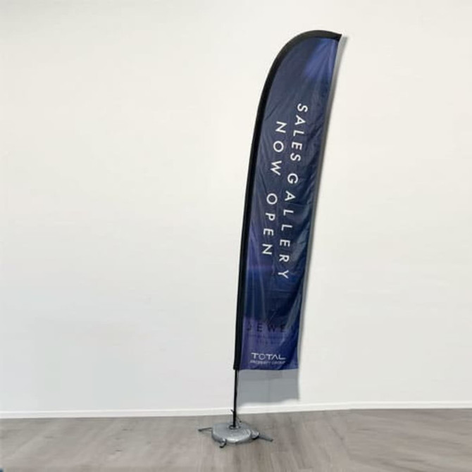 A tall, curved feather flag with a dark blue design and a base for stability, featuring branding.