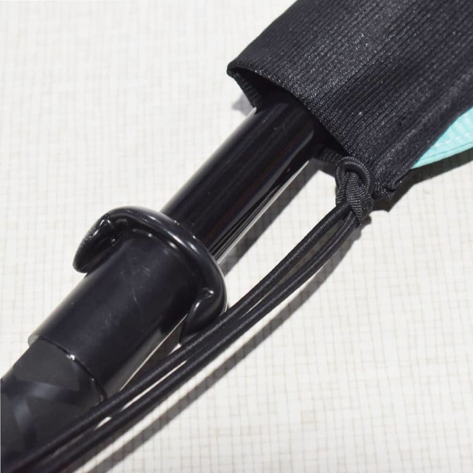 A black pole with a protective sleeve and elastic cord, part of a feather flag set.