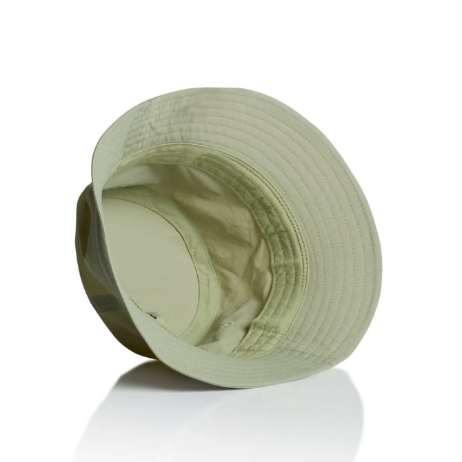 A light green nylon bucket hat with an interior lining and a logo. The hat has a wide brim and is designed for headwear.