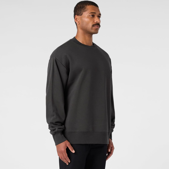A dark grey jumper with long sleeves and a relaxed fit, featuring a simple design and a logo.