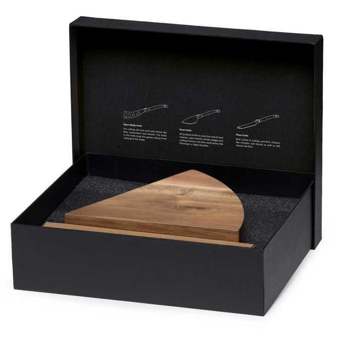 A wedge-shaped wooden cheese knife block set in a black box, featuring a textured interior and a branding logo.