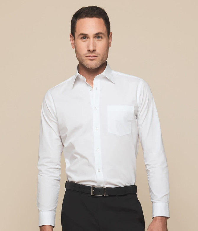 A white button-up shirt with long sleeves and a chest pocket, worn by a model against a neutral background.