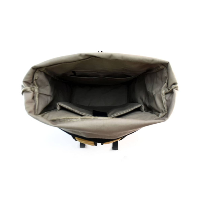 An open backpack in grey with multiple compartments and a top flap, featuring a logo on the exterior.