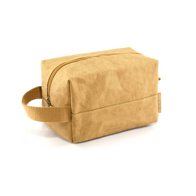 A kraft paper cosmetic bag in a tan colour with a zip closure and a side handle. It has a simple, modern design.