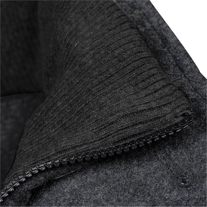A close-up of a black wool jacket featuring a textured collar and zip detail. The fabric appears warm and stylish.