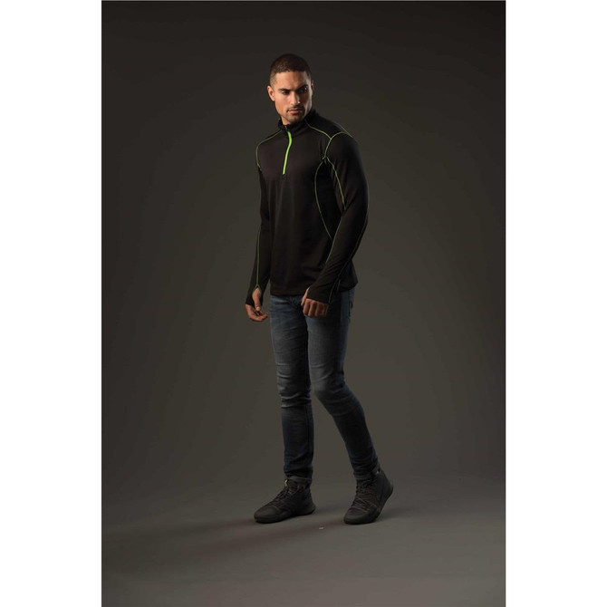 A men's black polar fleece pullover with green accents, displayed on a model against a dark background.