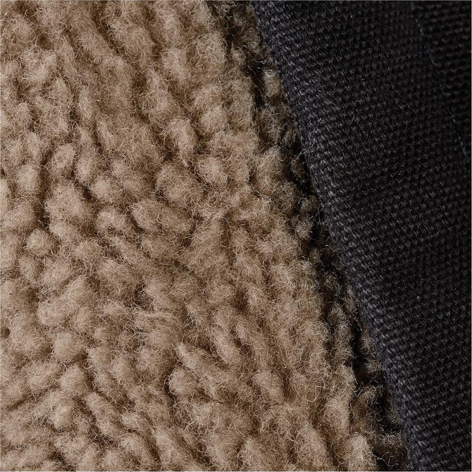 Close-up of a men's work jacket featuring a textured tan fleece and a black fabric lining. The jacket has a logo detail.
