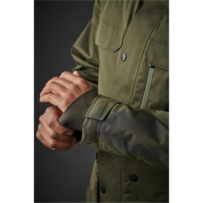A close-up of a men's thermal jacket in olive green, featuring a sleek design and textured cuffs.