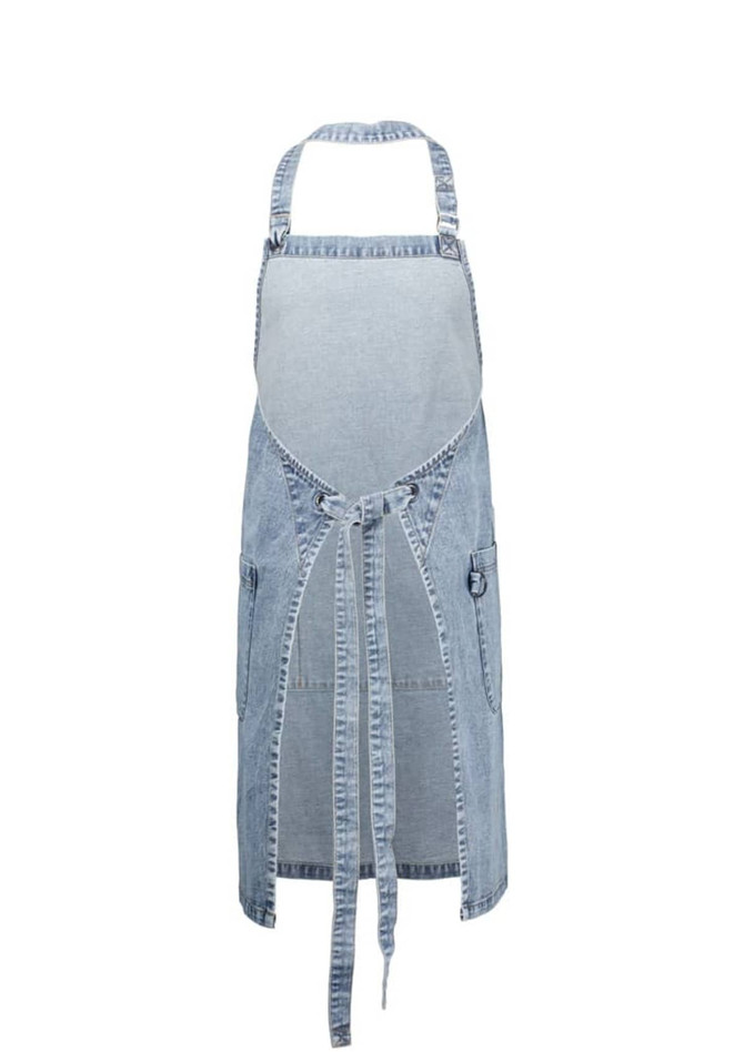 A blue denim apron features an open front, adjustable straps, and side pockets, with a logo on it.