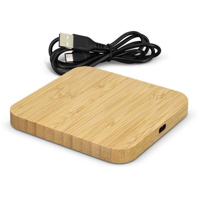 A bamboo wireless charging hub with a smooth surface and a USB cable attached.