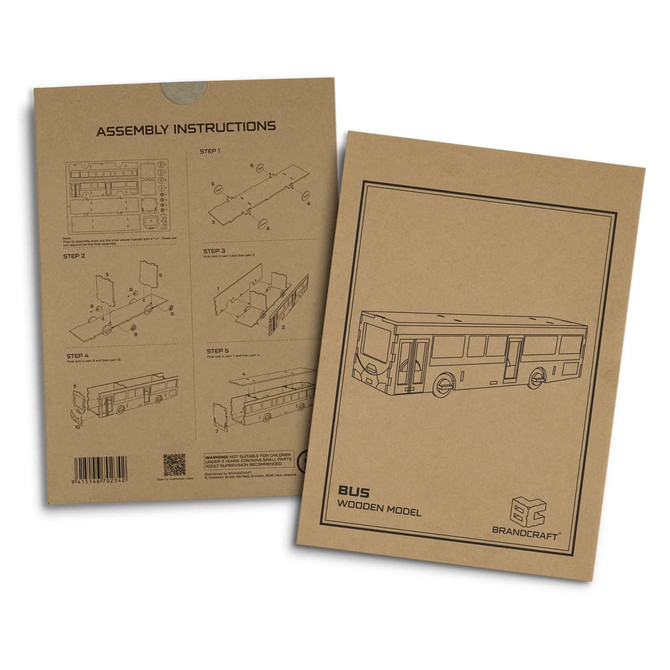 A cardboard assembly instruction booklet for a wooden bus model in a neutral brown colour. It includes step-by-step guidance.