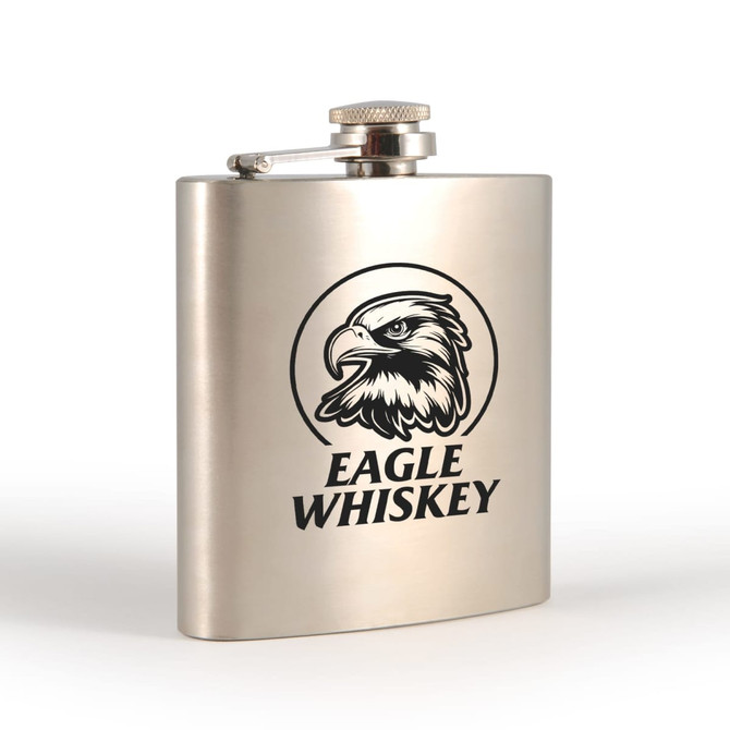 A stainless steel hip flask with a polished finish and an eagle logo on the front.