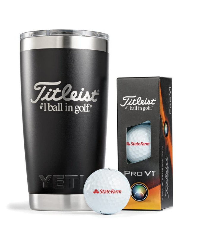 A drink bottle in matte black with a logo, next to a box of Titleist Pro V1 golf balls.