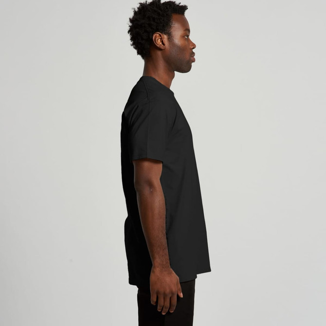 A black recycled t-shirt displayed on a model from the side, featuring a simple design and a logo.