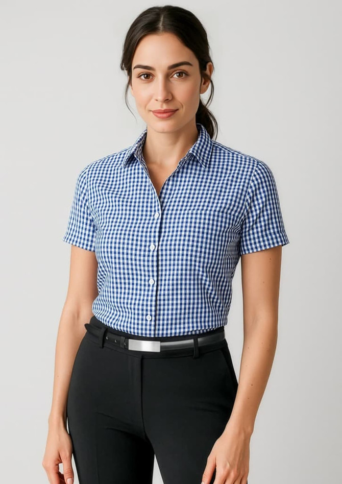 A short sleeve blue and white checked button-up shirt with a collar, featuring a logo.