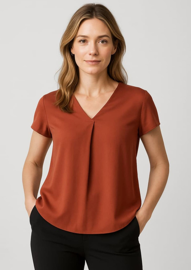 A rust-coloured women's V-neck blouse with short sleeves and pleat detail, featuring a logo on the tag.