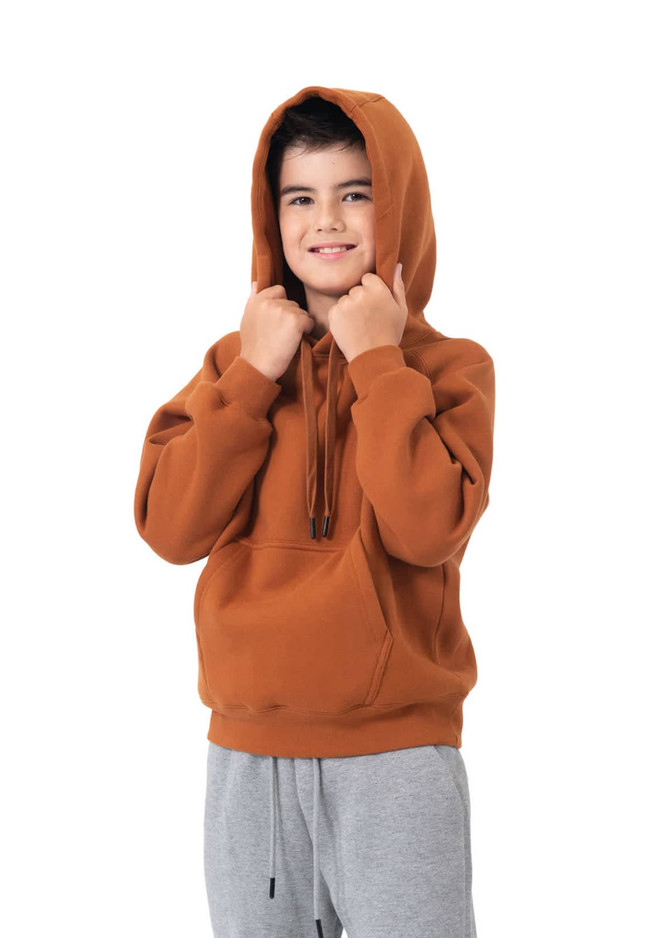 A child models a brown cotton hoodie with a kangaroo pocket and a drawstring hood, paired with grey pants.