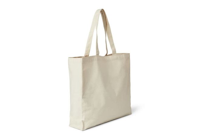 A cream-coloured tote bag with long straps and a simple design, featuring a logo.