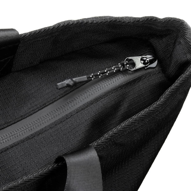 A black cooler bag featuring a zippered closure and sturdy straps. It has a textured interior lining.