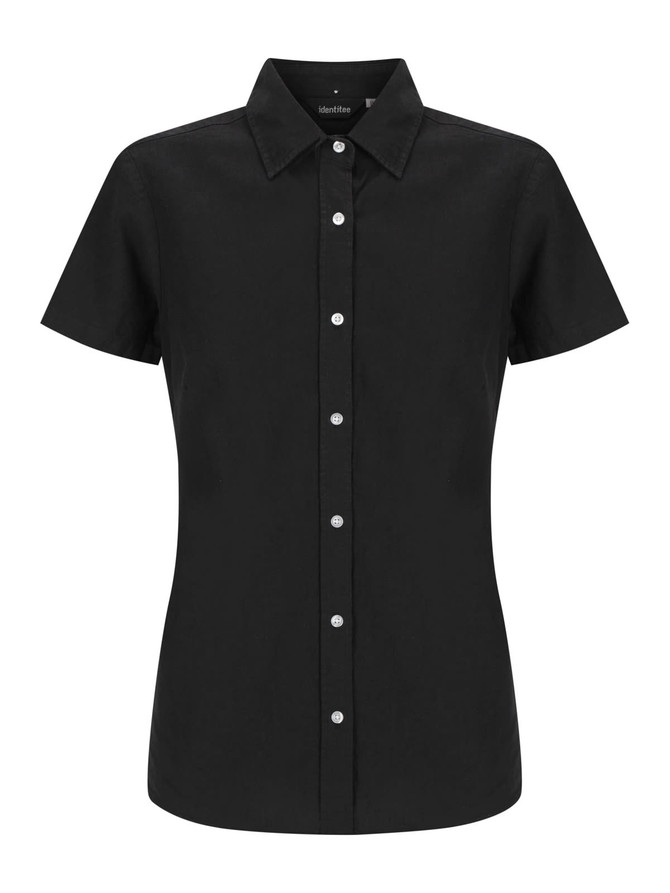 A black ladies' short sleeve shirt with a fitted design and button placket, featuring a logo on the label.