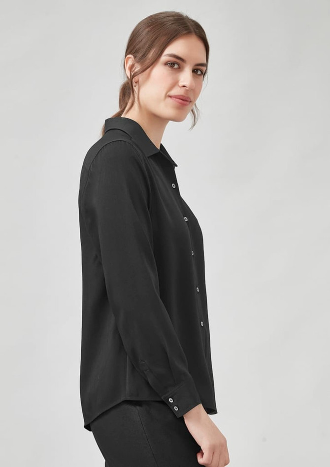 A black long sleeve shirt with a button-down front and a relaxed fit. It features a collar and long sleeves. A black long sleeve shirt with a button-down front and a relaxed fit. It features a collar and long sleeves.