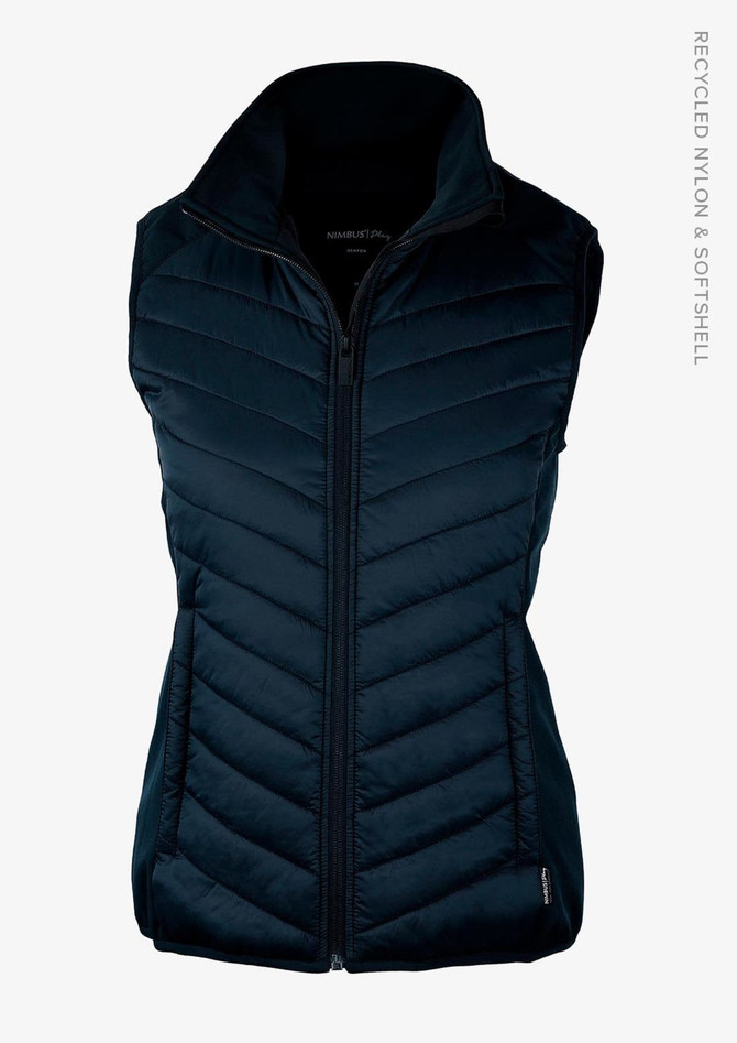 A navy blue women's vest with a zip front and quilted design, featuring a logo on the side.