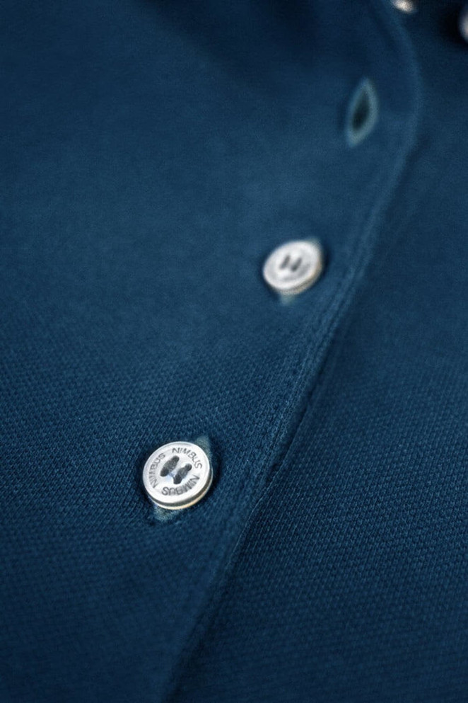 A navy blue polo shirt featuring buttons and a collar, with a logo.