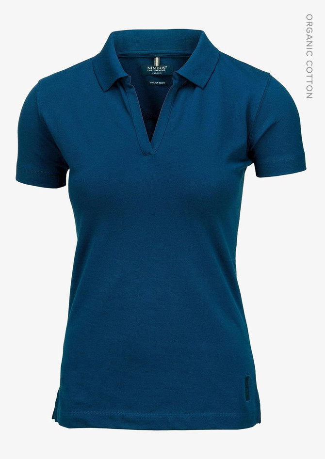 A women's v-neck polo shirt in a deep teal colour, featuring a collar and a logo. Made from organic cotton.