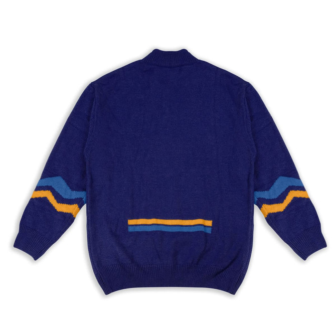 A blue knitted jumper featuring vibrant yellow and turquoise stripes on the sleeves and back.