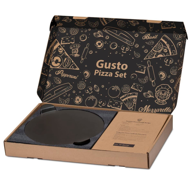 A pizza baking set in a cardboard box featuring a black pizza stone and branded packaging with food illustrations. A pizza baking set in a cardboard box featuring a black pizza stone and branded packaging with food illustrations.