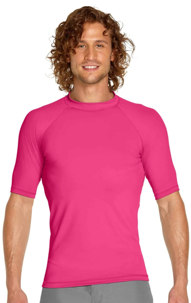 A vibrant pink adult short sleeve rashie with a fitted design, featuring a logo on the front.