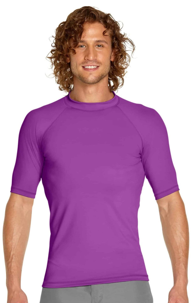 A purple adult short sleeve rashie featuring a fitted design and a logo on the chest.