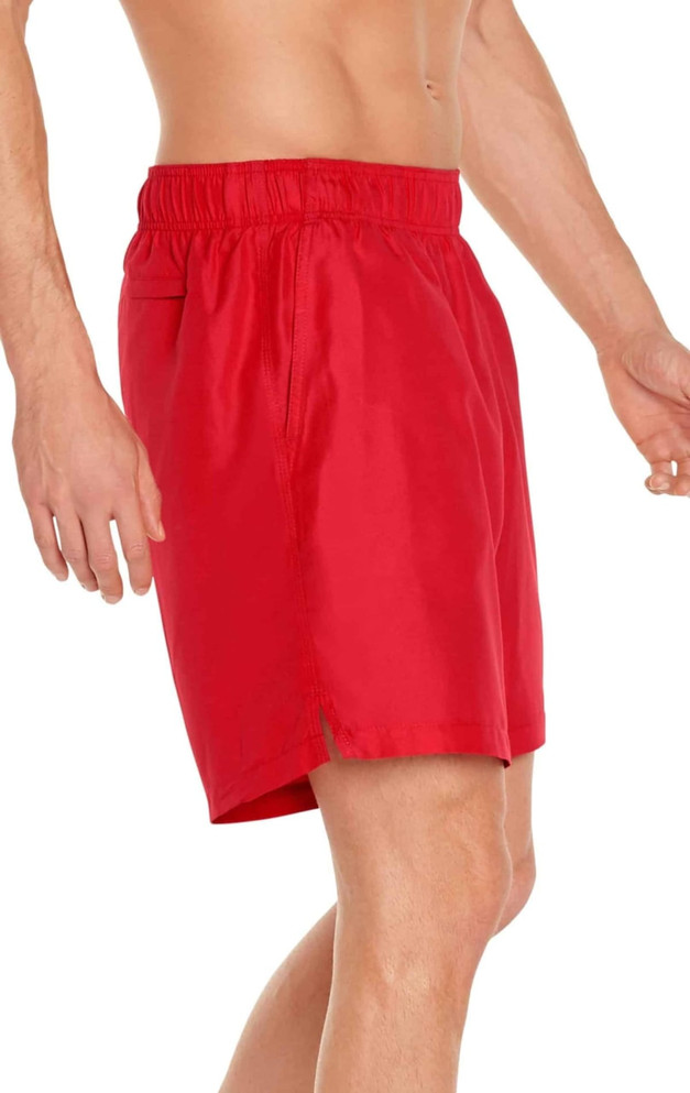 A pair of red men's swim trunks designed for sun protection, featuring an elastic waistband and side pocket.