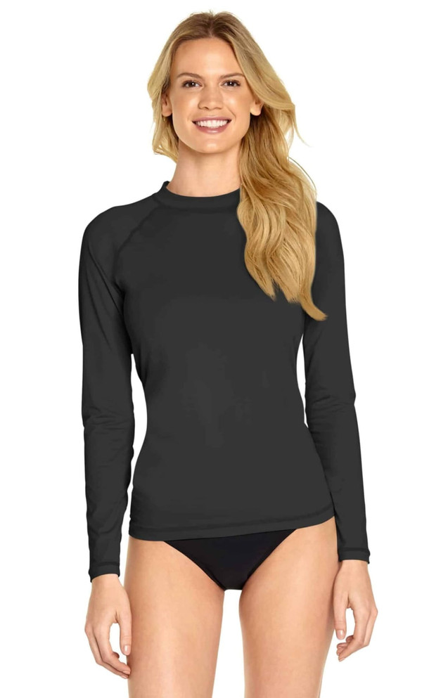A long sleeve rashie in black with a fitted design, featuring a logo on the garment.