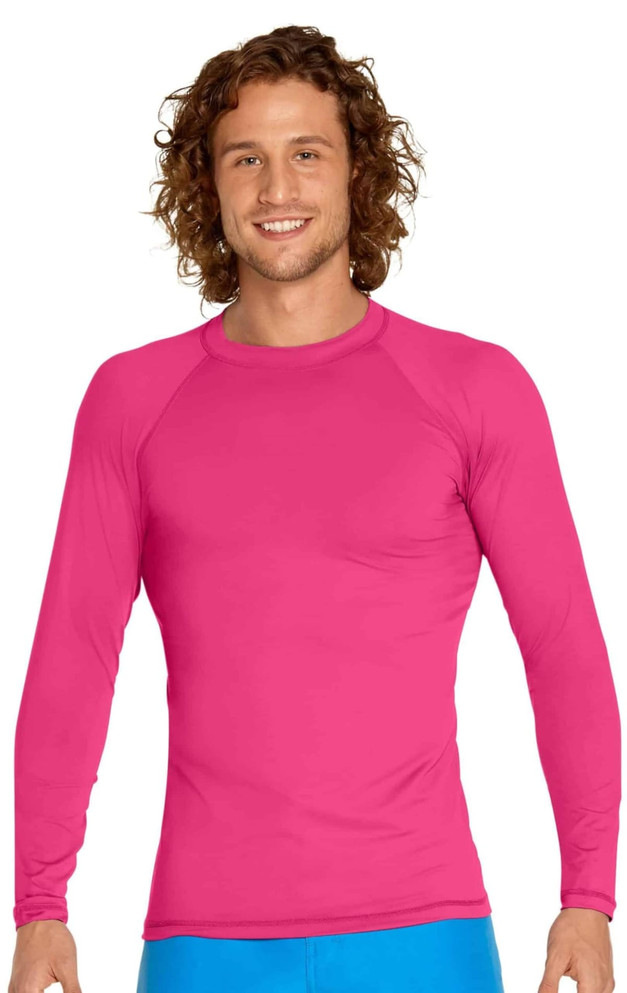 A long sleeve rashie in bright pink, featuring a fitted design and a logo on the chest.