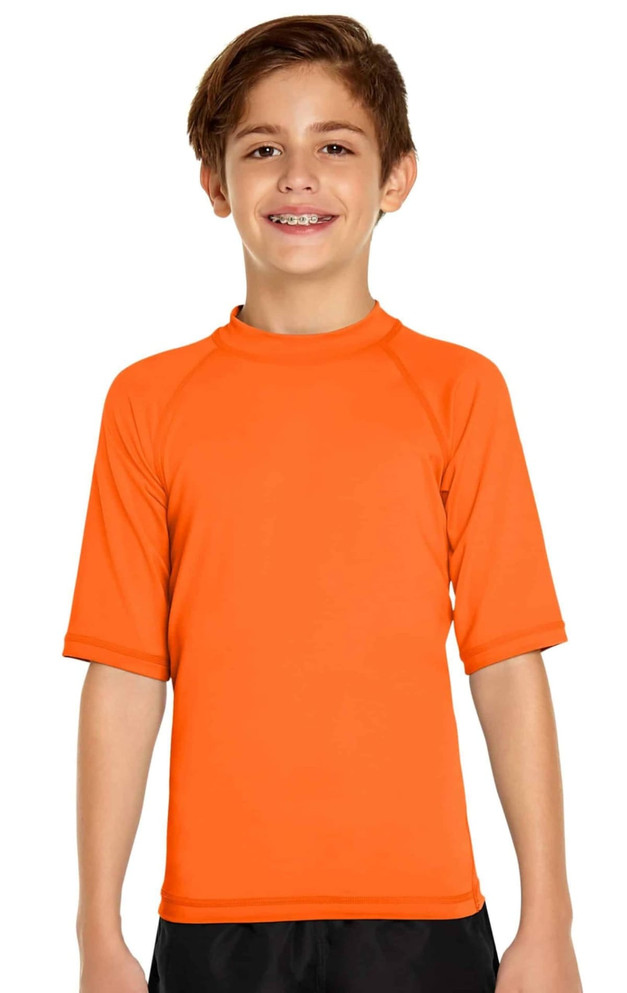 A youth short sleeve rashie in vibrant orange, featuring a logo, designed for sun protection with UPF 50+.