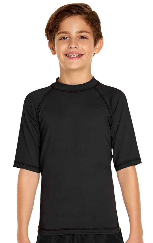 A youth short sleeve rashie in black, featuring a simple design and a logo on the chest.