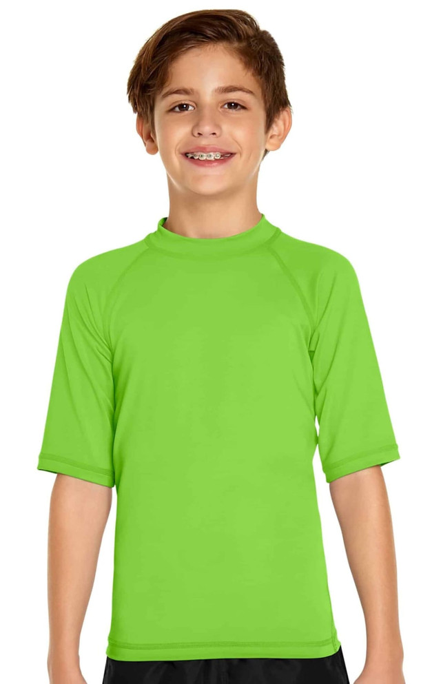 A bright green youth short sleeve rashie with a fitted design and a logo on the front.