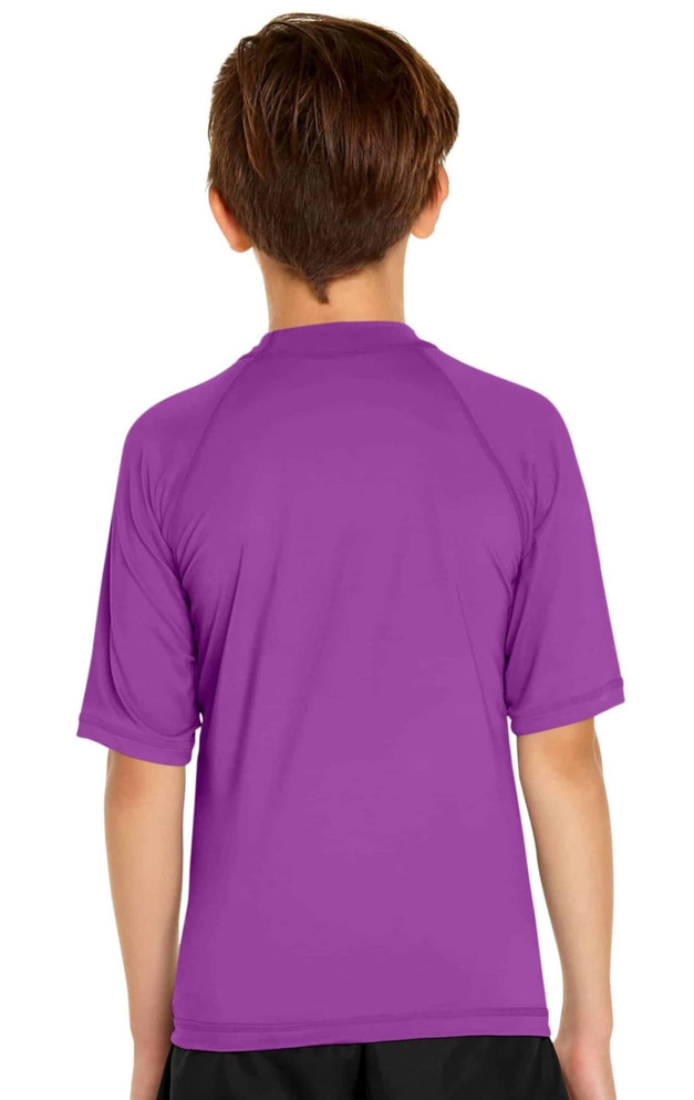 A purple youth short sleeve rashie featuring a back view, made for sun protection with UPF 50+.