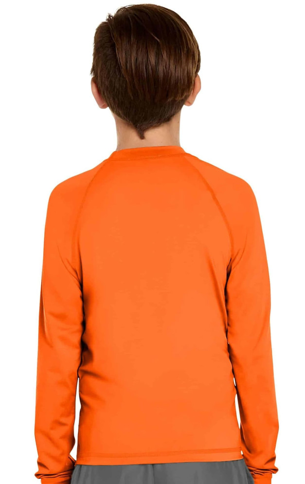 An orange long sleeve rashie with a UPF 50+ rating for youth, featuring a simple design without visible branding.