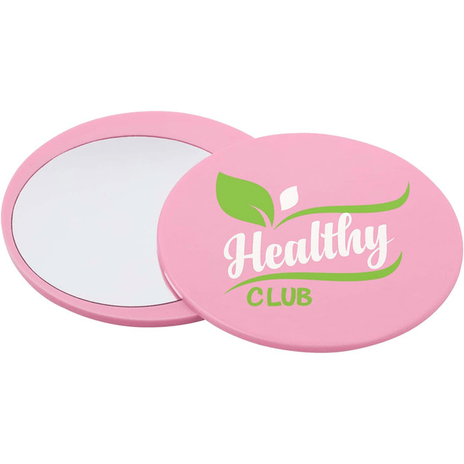 A pink circular makeup mirror with a glossy finish, featuring a logo and a reflective surface.