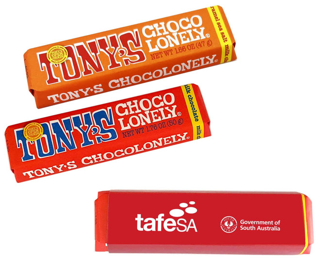 Three wrapped chocolate bars in vibrant orange and red packaging, featuring a logo on each wrapper.