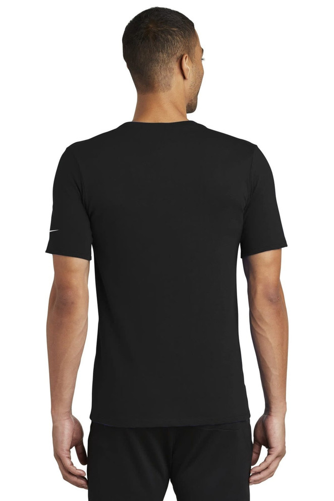 A black Nike Dri-FIT Cotton/Poly Tee, viewed from the back, featuring a small logo on the sleeve. A black Nike Dri-FIT Cotton/Poly Tee, viewed from the back, featuring a small logo on the sleeve.
